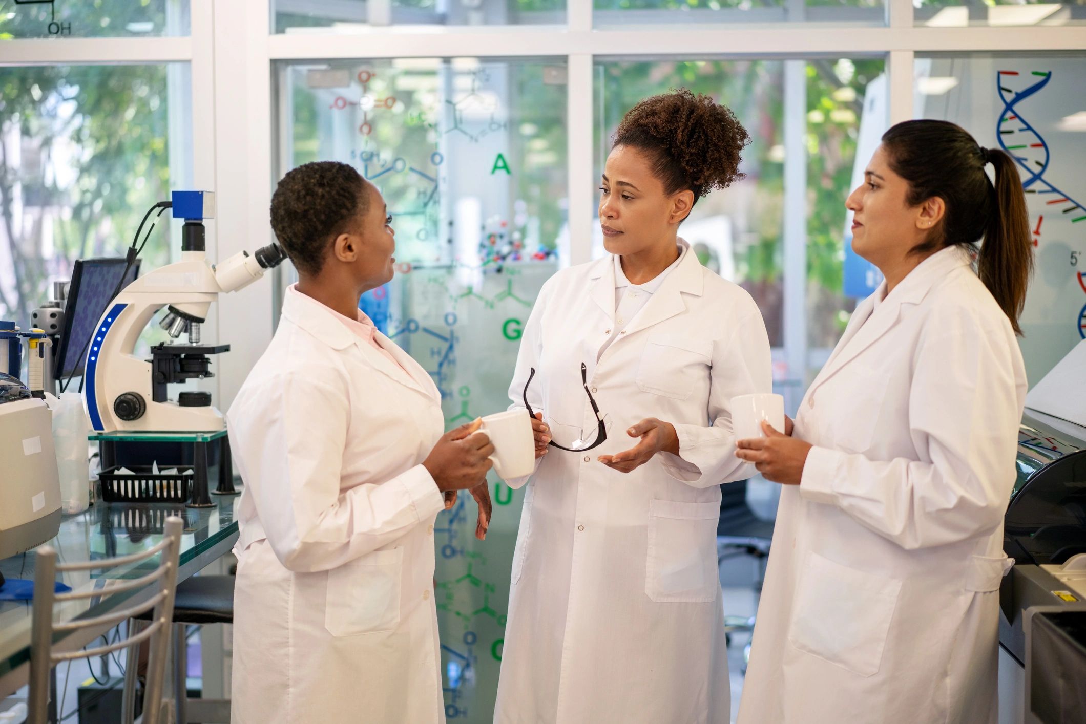 Women in STEM working together in a biotechnology setting