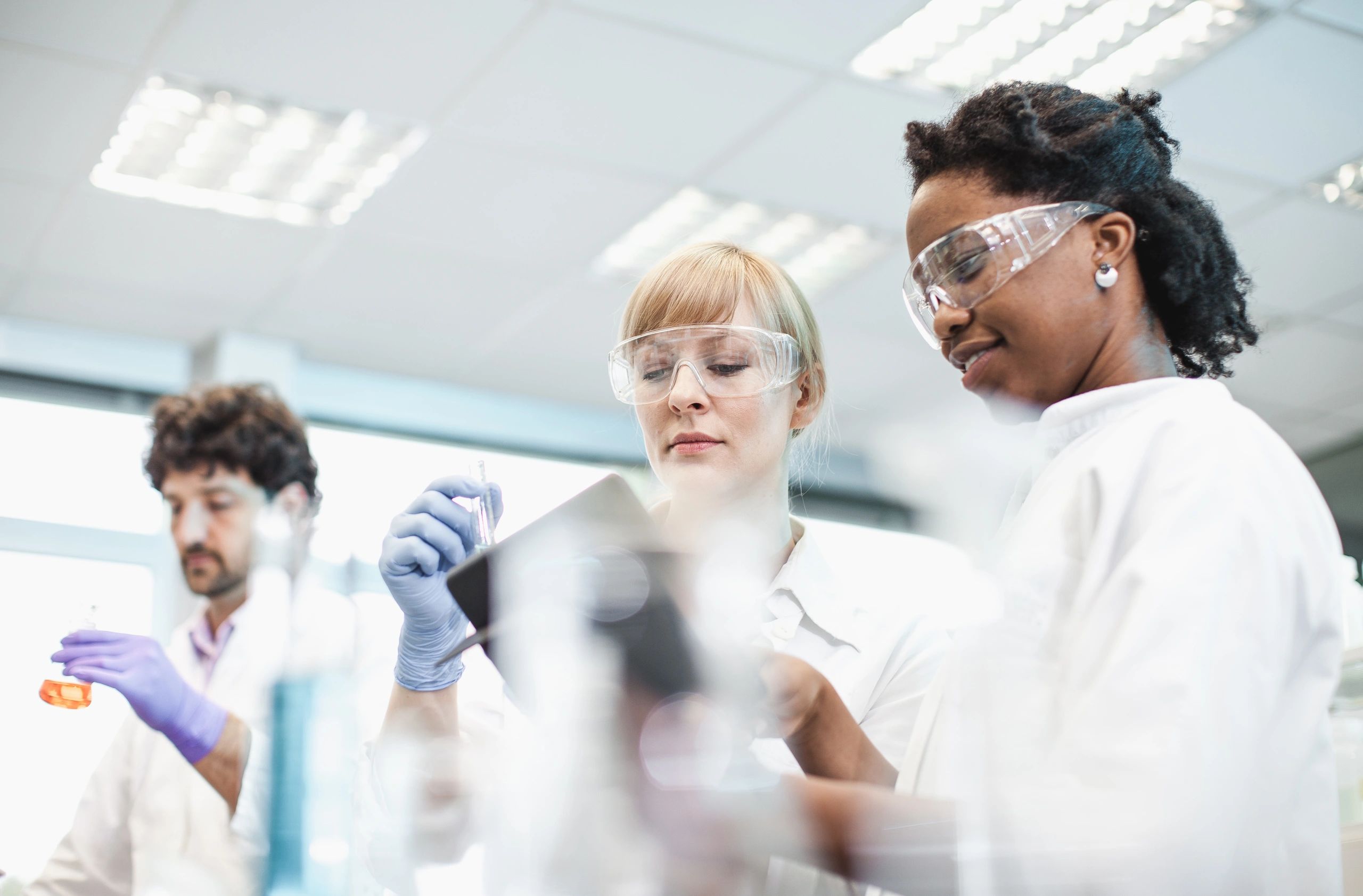biotech women teamwork laboratory spirulina algae research